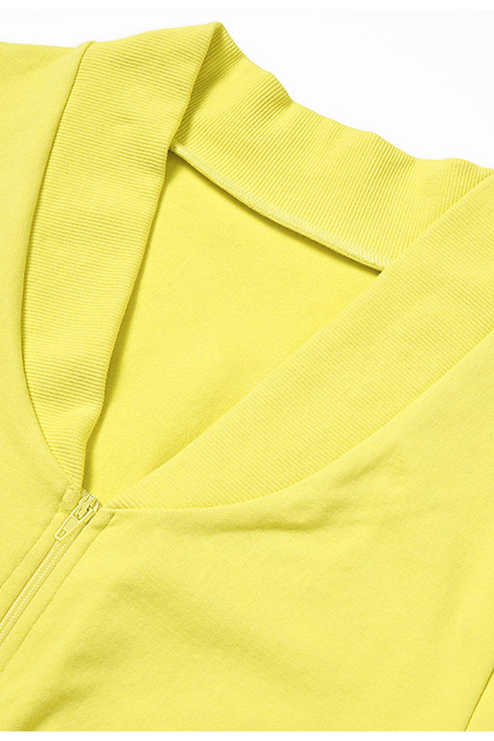 A vibrant yellow long sleeve crop top paired with stylish flare pants, perfect for workouts and casual wear.