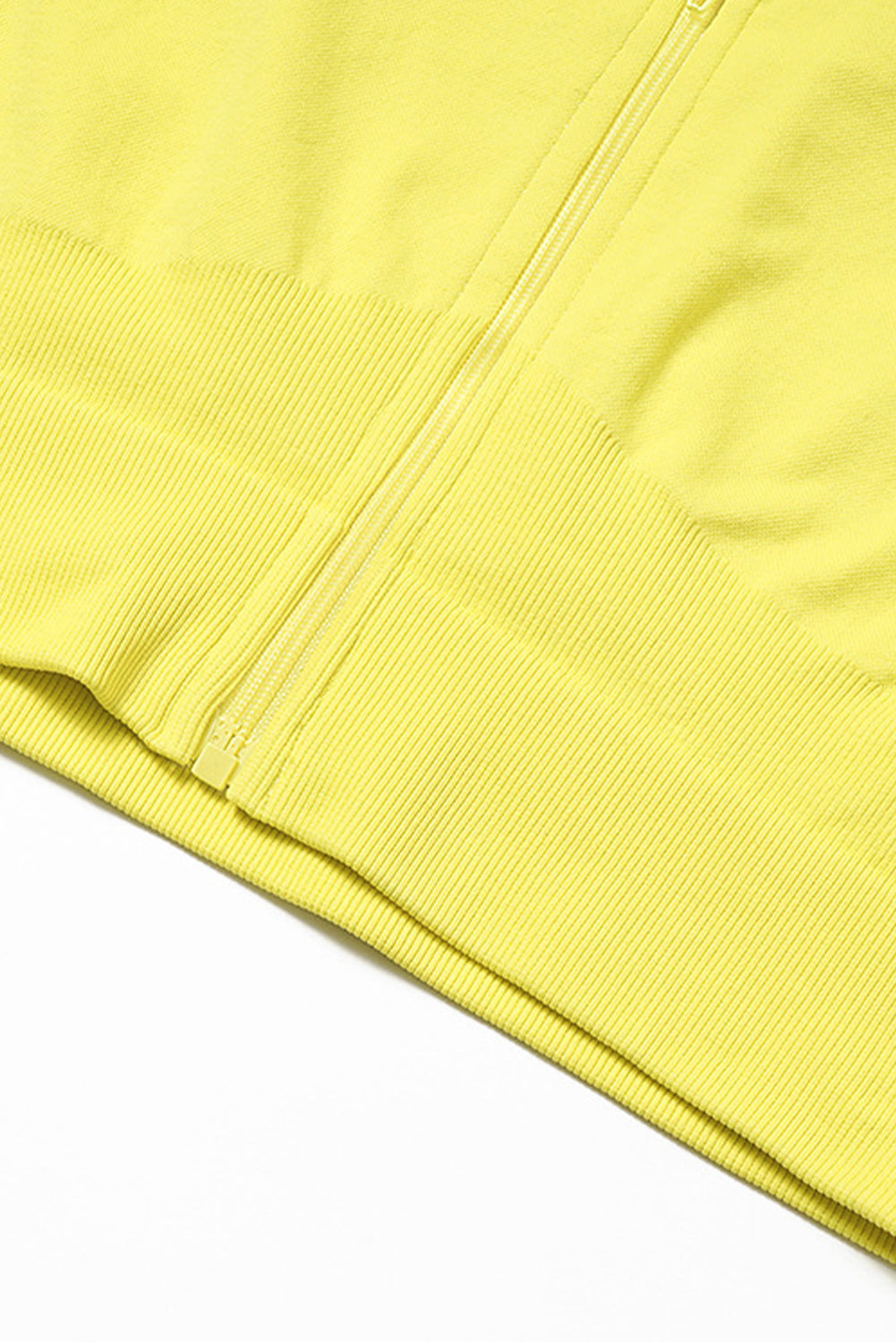 A vibrant yellow long sleeve crop top paired with stylish flare pants, perfect for workouts and casual wear.