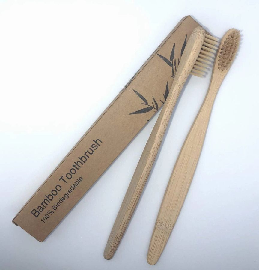 Zero-Waste Bath Accessories Bundle featuring bamboo toothbrush, comb, loofah, and bath brush, all eco-friendly and stylish.