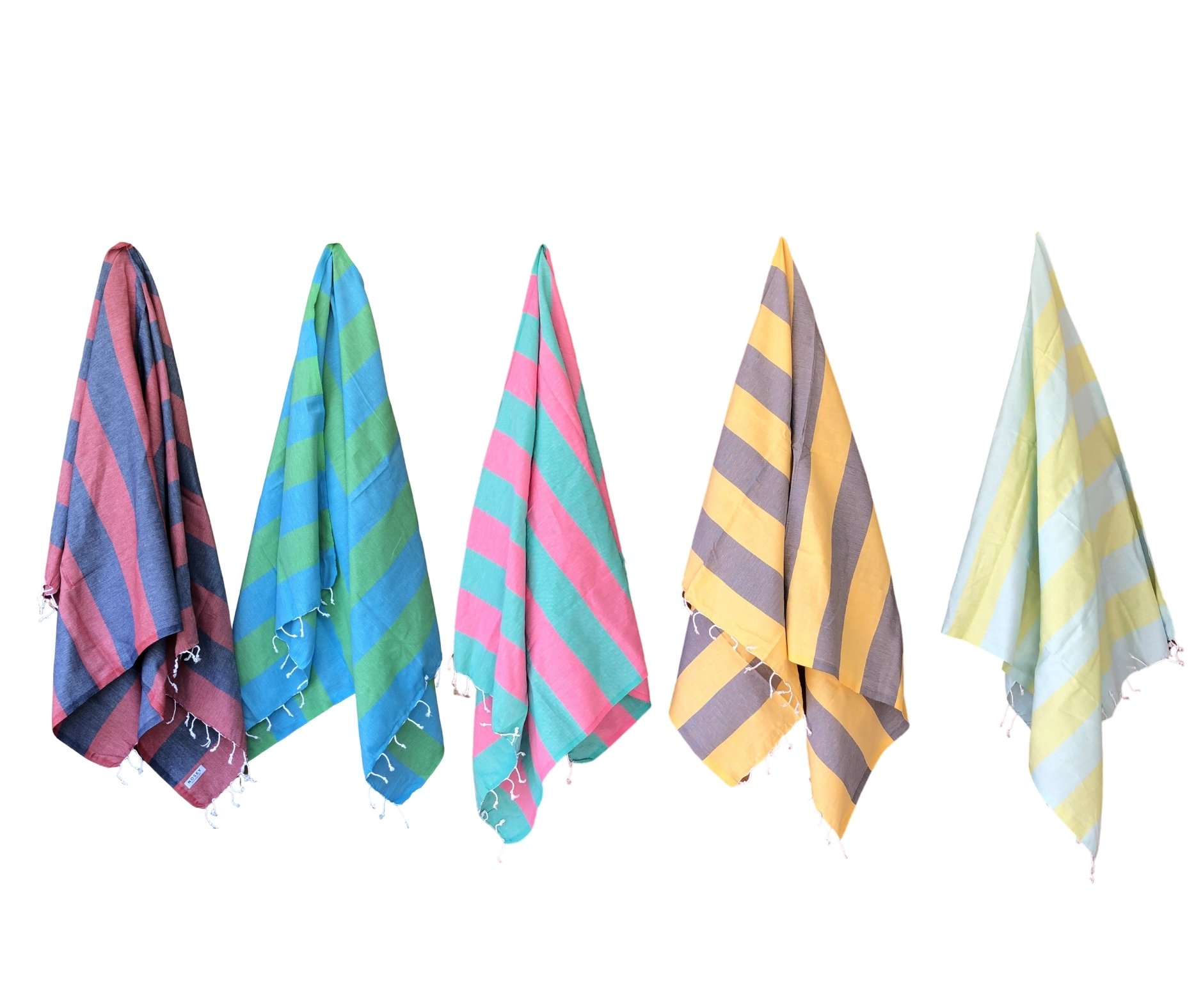 Zuma Turkish Towel featuring vibrant stripes and hand-twisted tassels, perfect for beach and pool use.