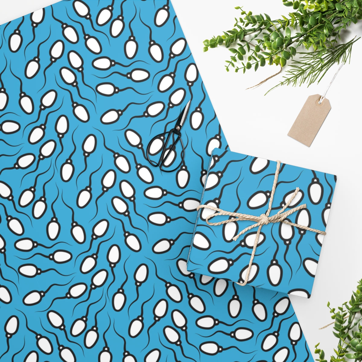 Blue Sperm Wrapping Paper featuring a playful sperm design on premium gloss paper, rolled up for easy storage.