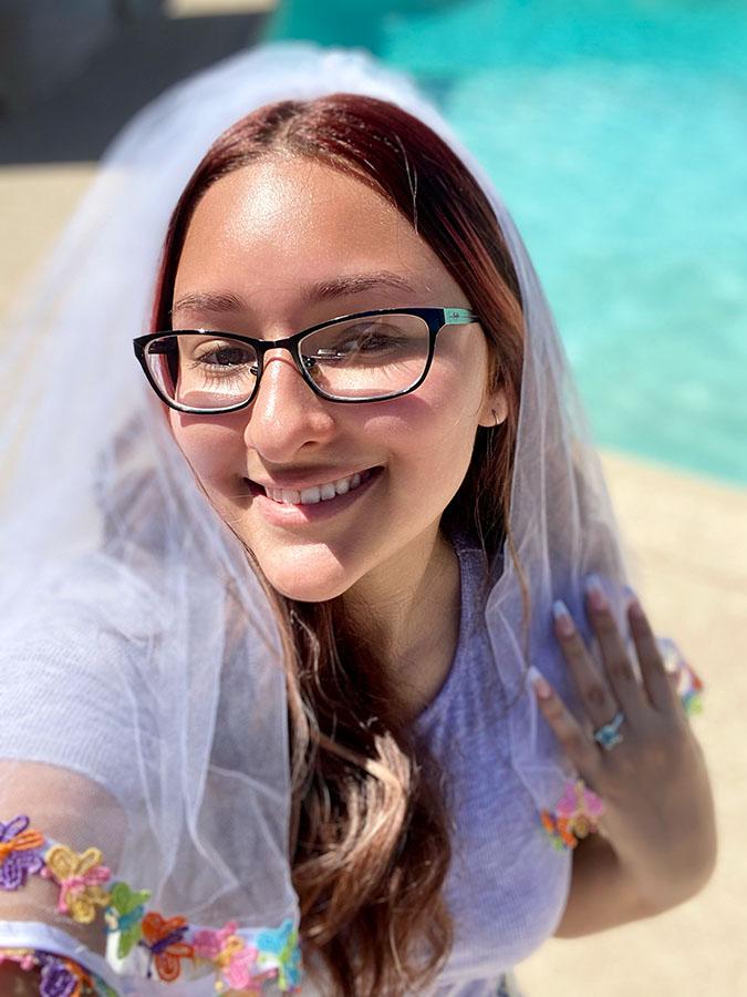 A vibrant 90's Retro Butterfly Bachelorette Party Veil with colorful butterfly trims and a secure hair comb, perfect for bachelorette celebrations.