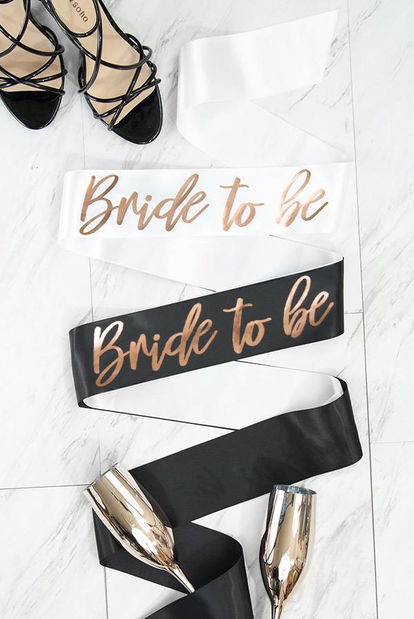 Bride To Be Foil Sash in rose gold satin with shiny foil accents, elegantly draped and ready for celebration.