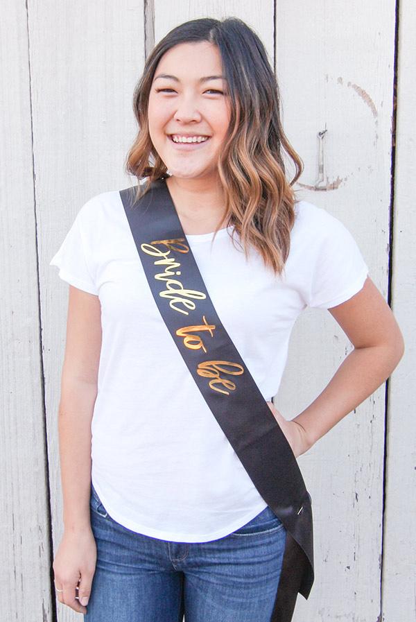 Bride To Be Gold Foil Sash in various colors, showcasing luxurious satin and shiny gold foil design.