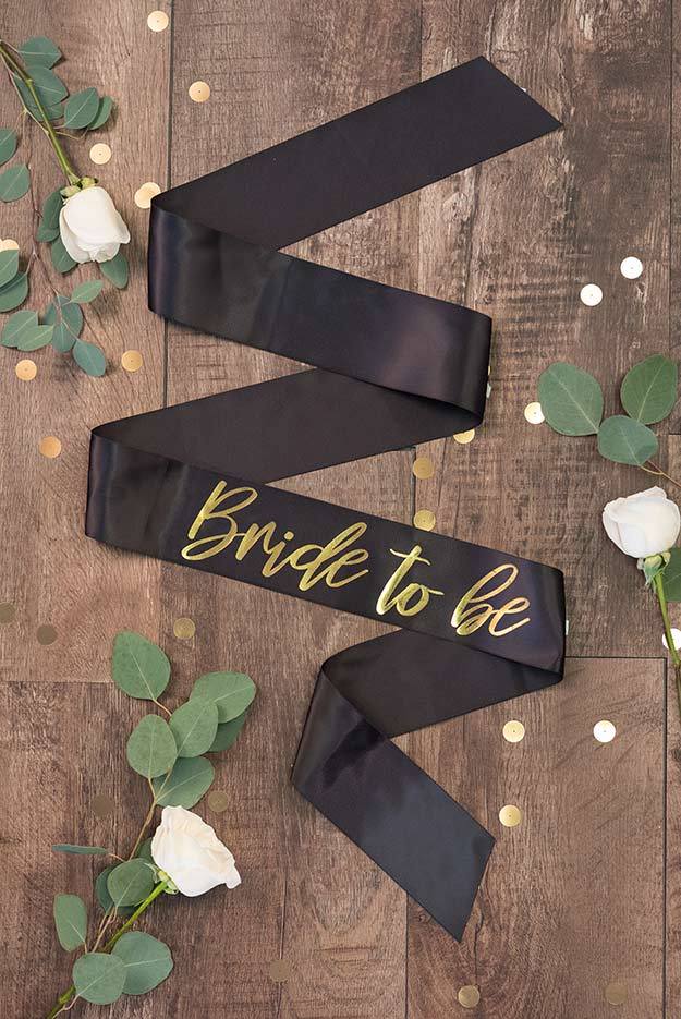 Bride To Be Gold Foil Sash in various colors, showcasing luxurious satin and shiny gold foil design.