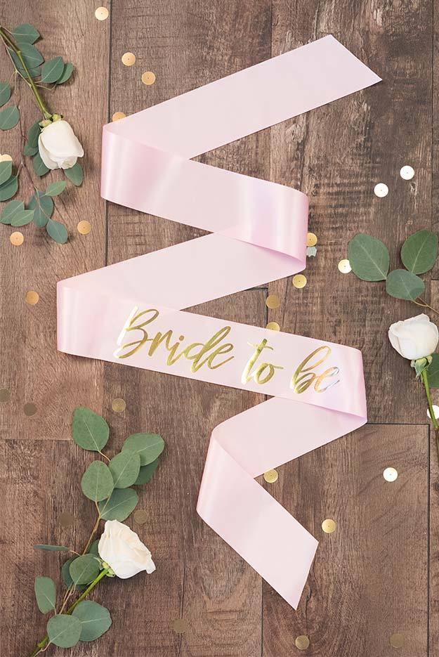 Bride To Be Gold Foil Sash in various colors, showcasing luxurious satin and shiny gold foil design.