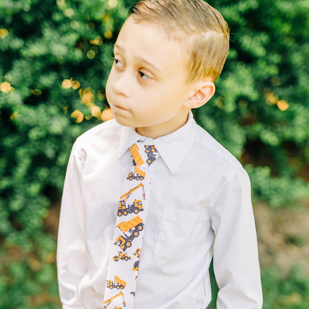 JOHN CHARLES Boys Velcro Tie featuring bright yellow diggers and cranes, perfect for young boys who love construction vehicles.