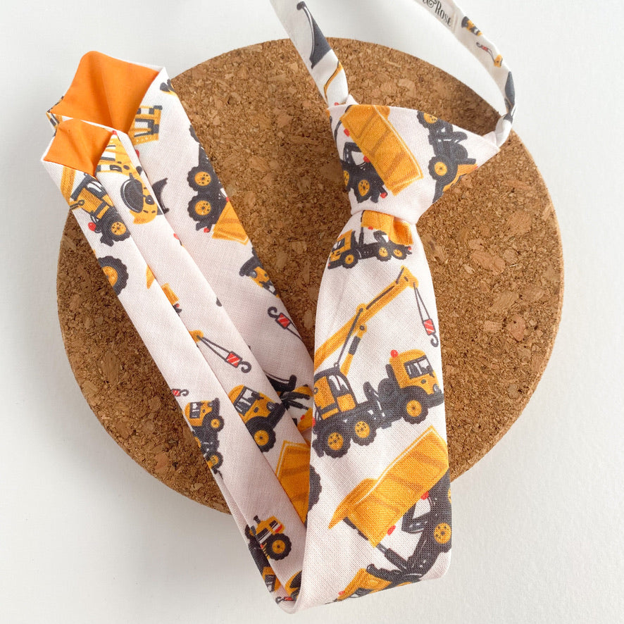 JOHN CHARLES Boys Velcro Tie featuring bright yellow diggers and cranes, perfect for young boys who love construction vehicles.