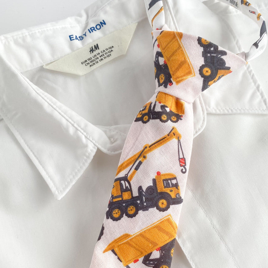 JOHN CHARLES Boys Velcro Tie featuring bright yellow diggers and cranes, perfect for young boys who love construction vehicles.