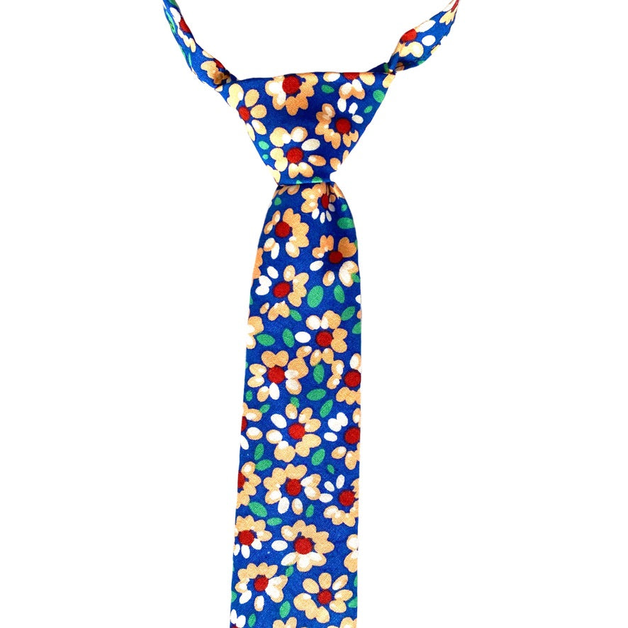 Colorful JUDE Floral Collection tie with abstract floral patterns, designed for children, featuring a pre-knotted design and Velcro fastening.