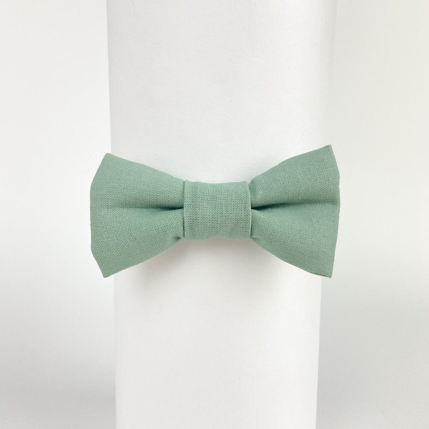 Sage green cotton boys bow tie, pre-tied with velcro fastening, perfect for weddings and special occasions.