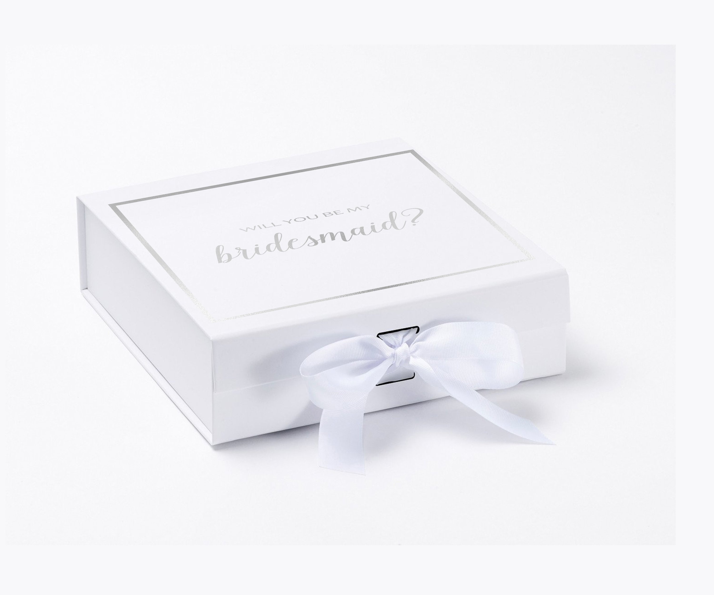 Elegant white gift box with gold metallic writing asking 'Will You Be My Bridesmaid', adorned with a black grosgrain ribbon.