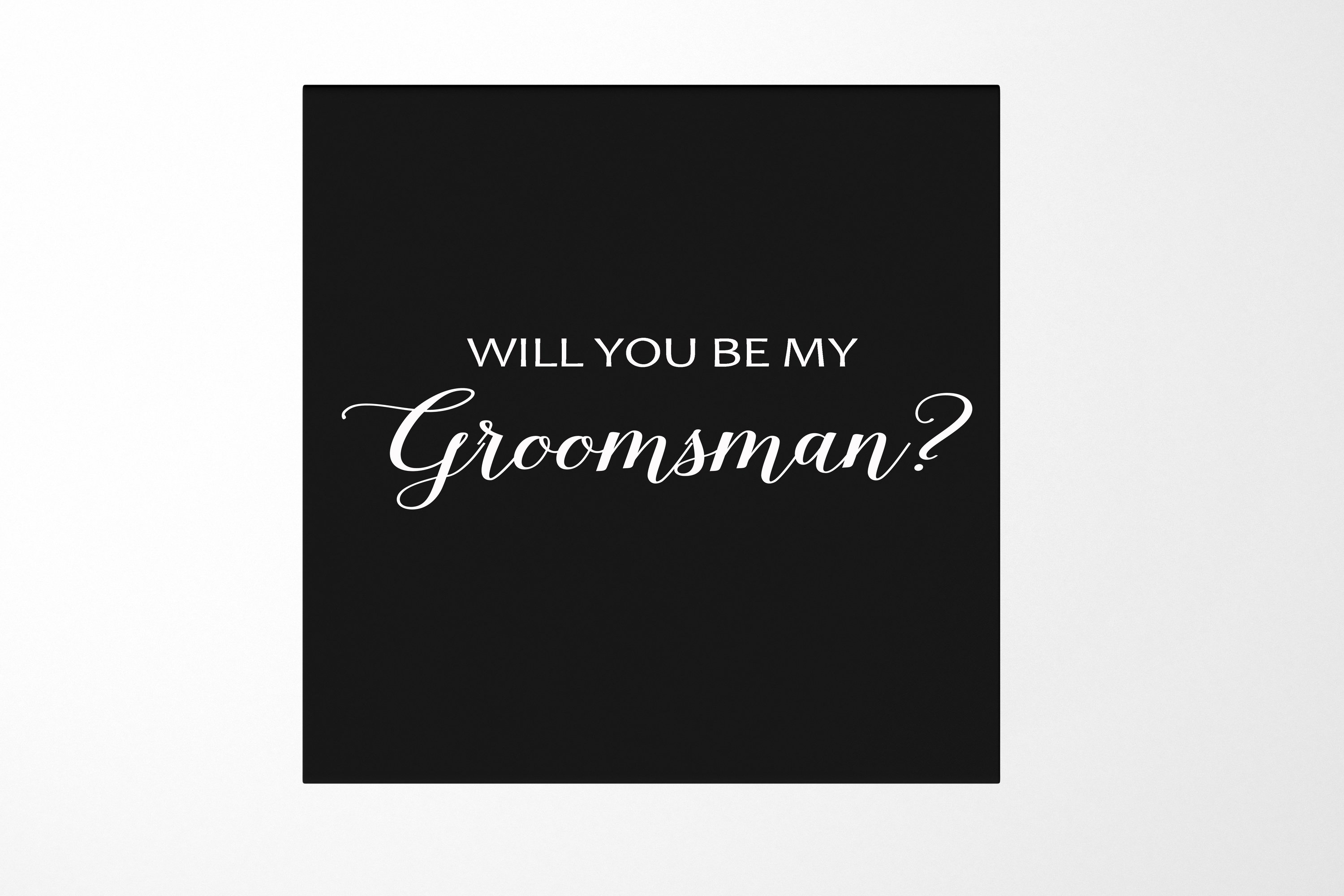 Elegant black groomsman proposal box with metallic writing on the lid, showcasing a sleek matte finish.