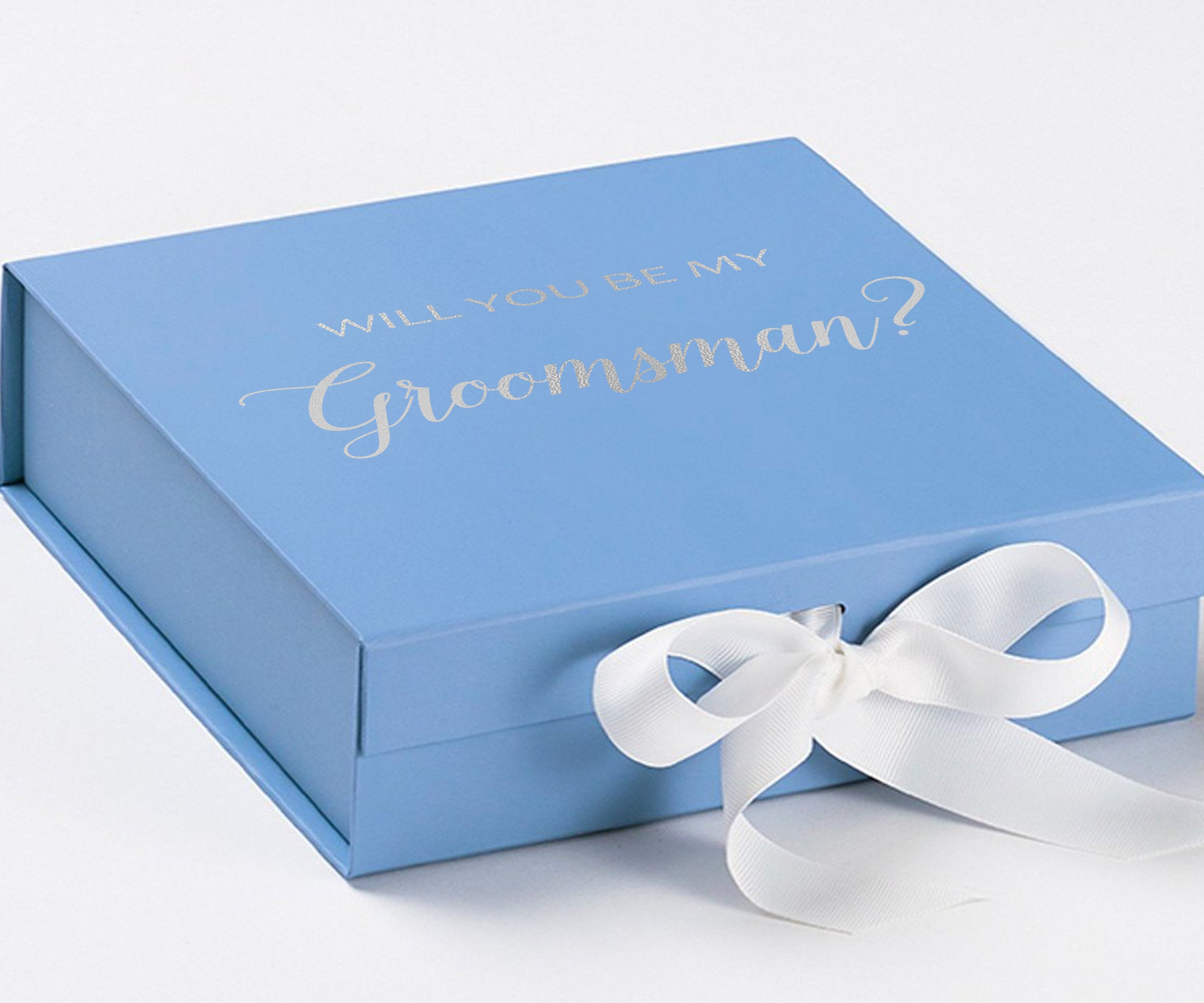 Light blue groomsman proposal box with white bow and metallic writing on the lid, showcasing its elegant design.