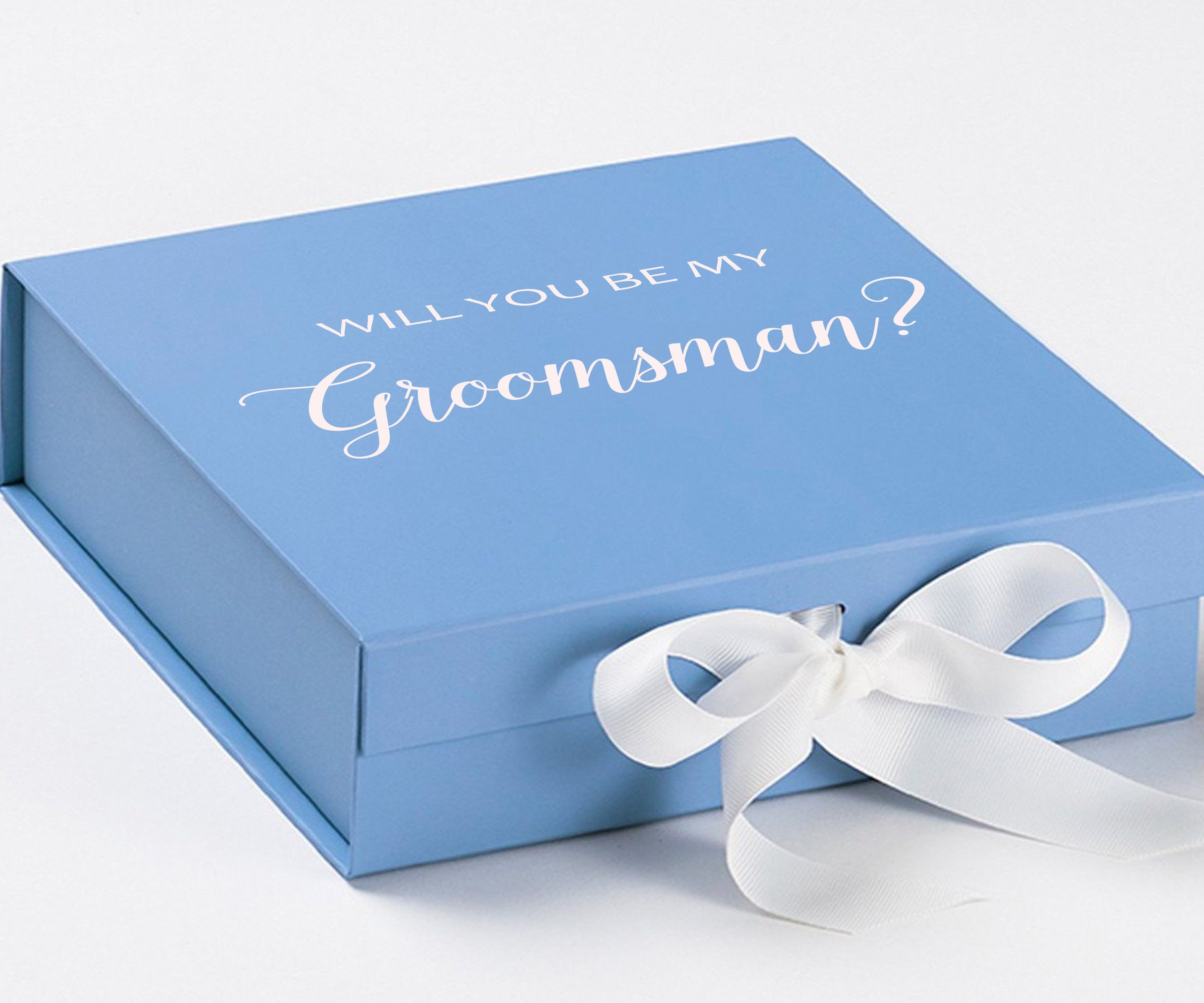 Light blue groomsman proposal box with white bow and metallic writing on the lid, showcasing its elegant design.