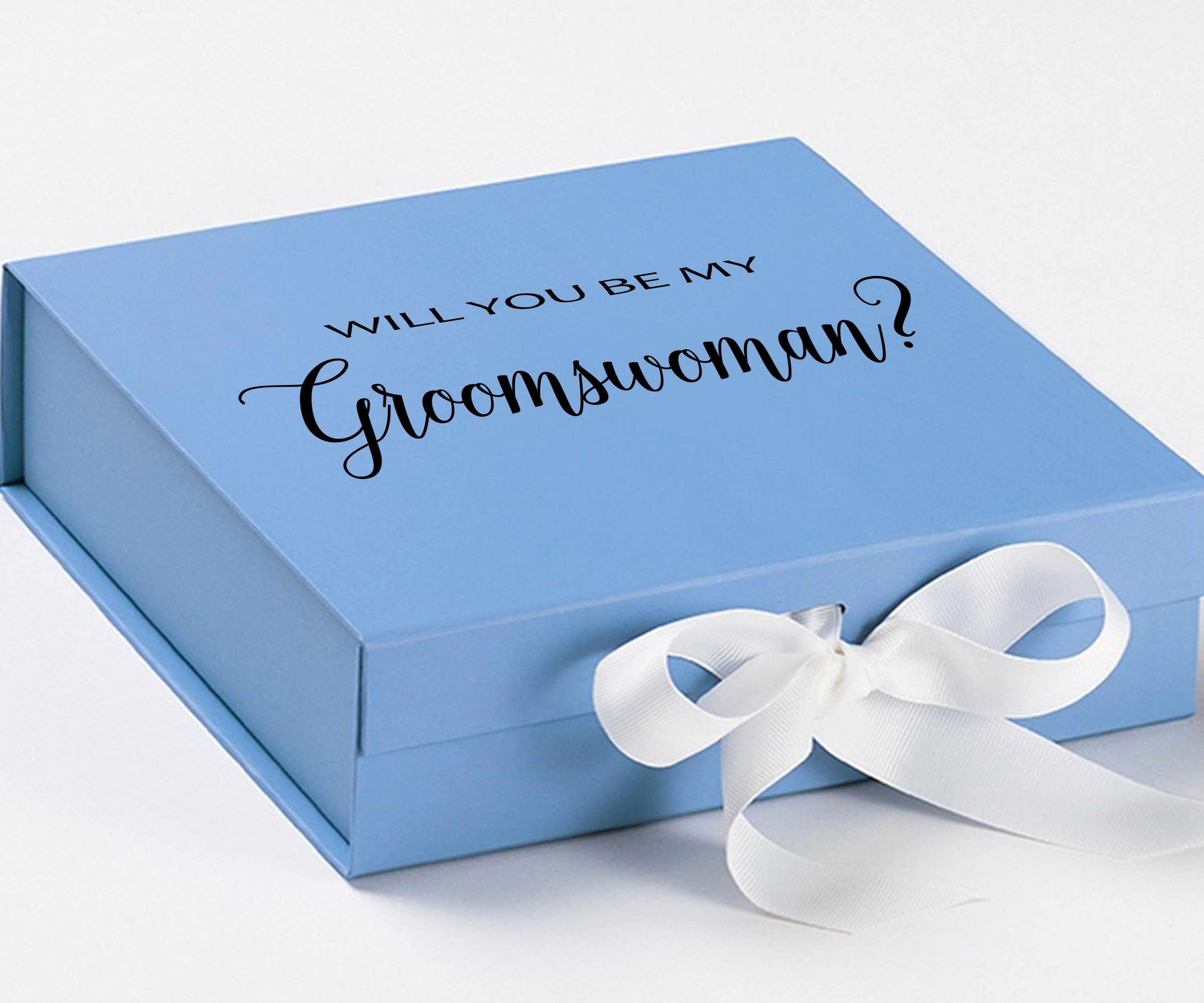 Light blue proposal box with white bow and metallic writing, showcasing elegant design for groomswoman proposal.