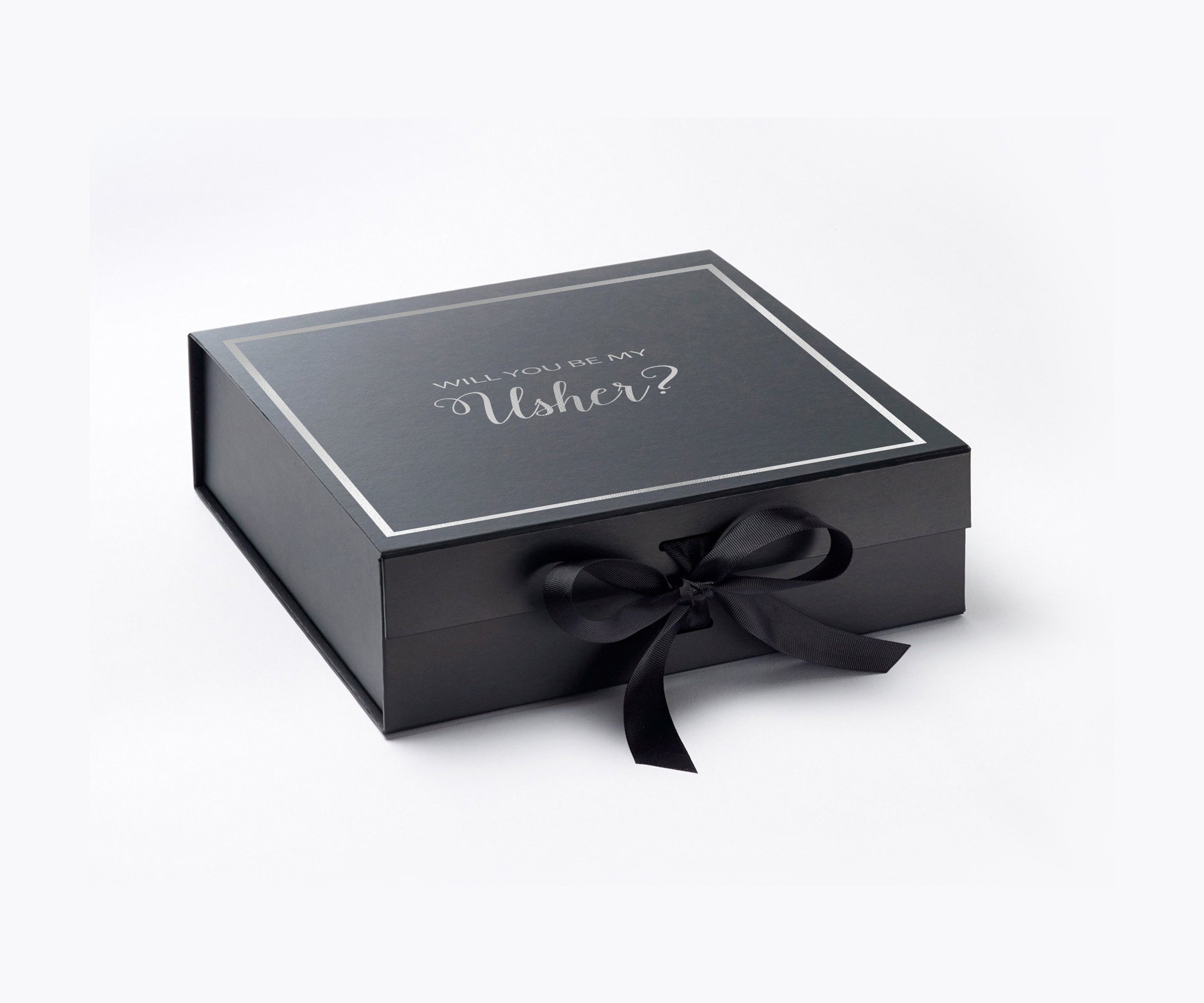 Black proposal box with metallic writing, featuring a black bow and elegant design.