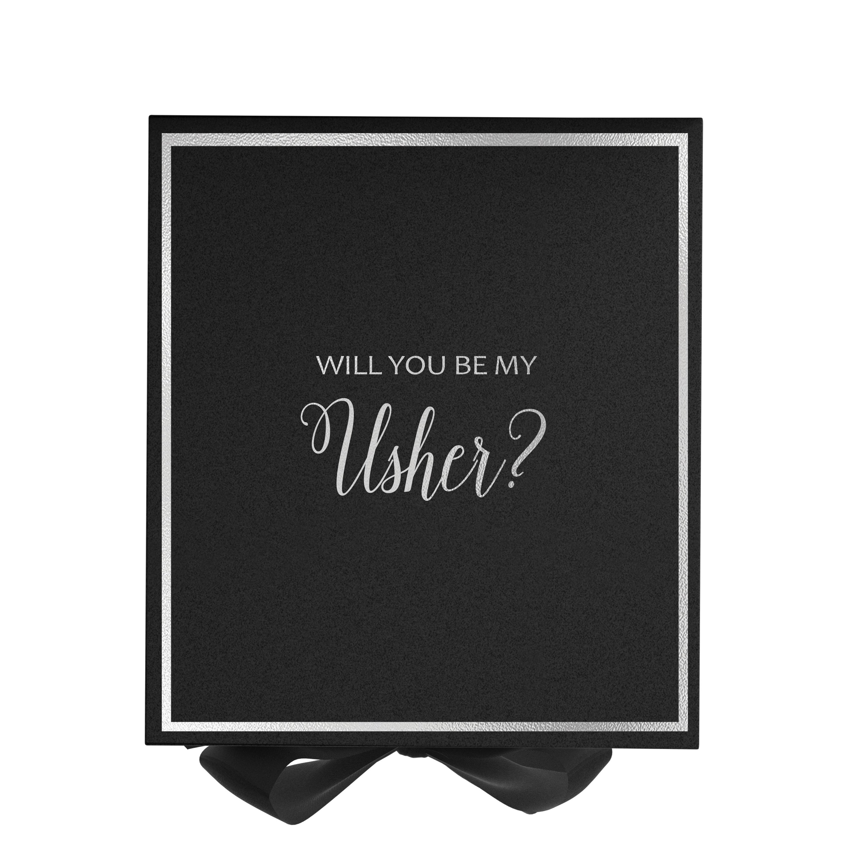 Black proposal box with metallic writing, featuring a black bow and elegant design.