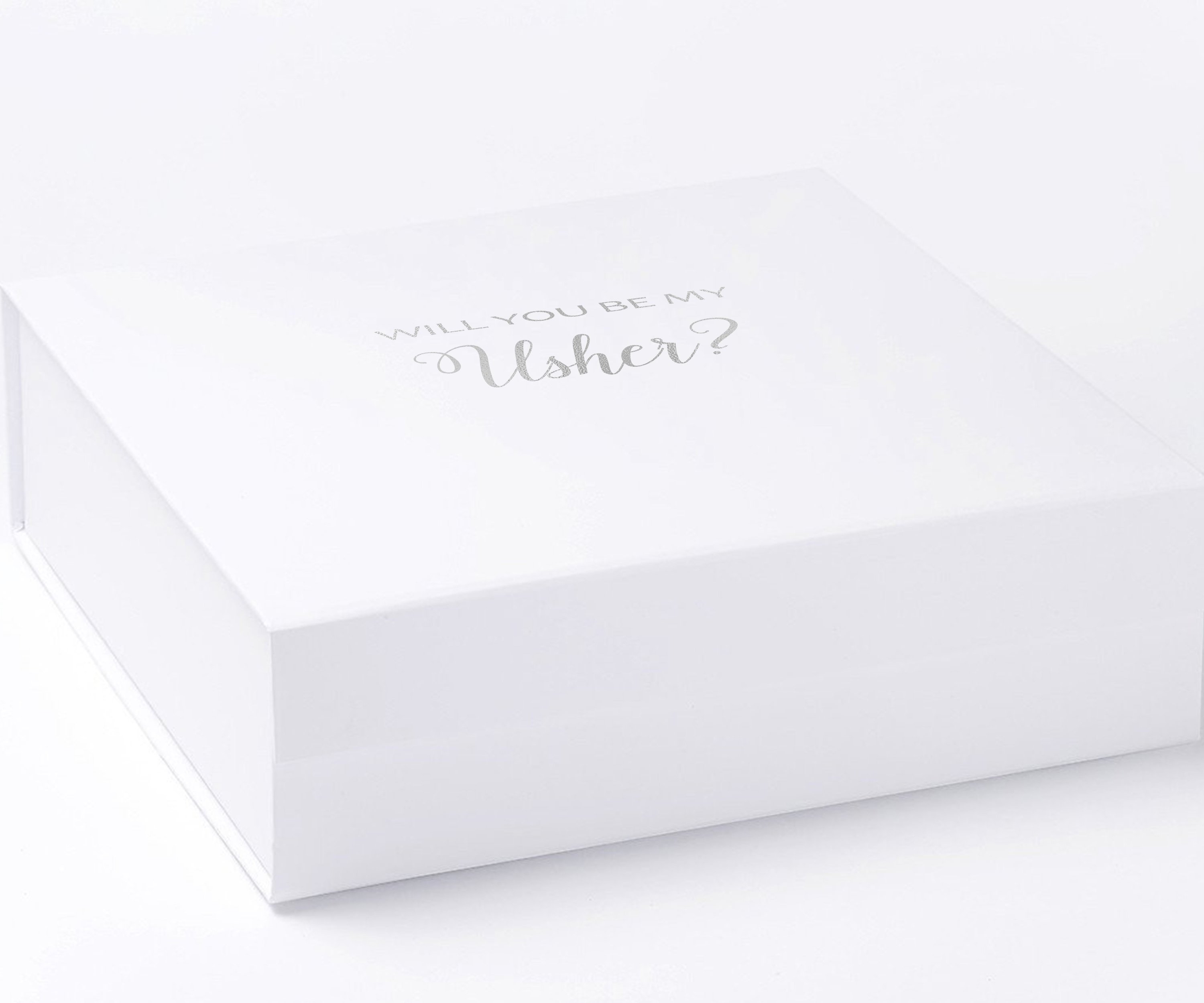 White proposal box with metallic writing on the lid, featuring a minimalist design without borders or ribbons.