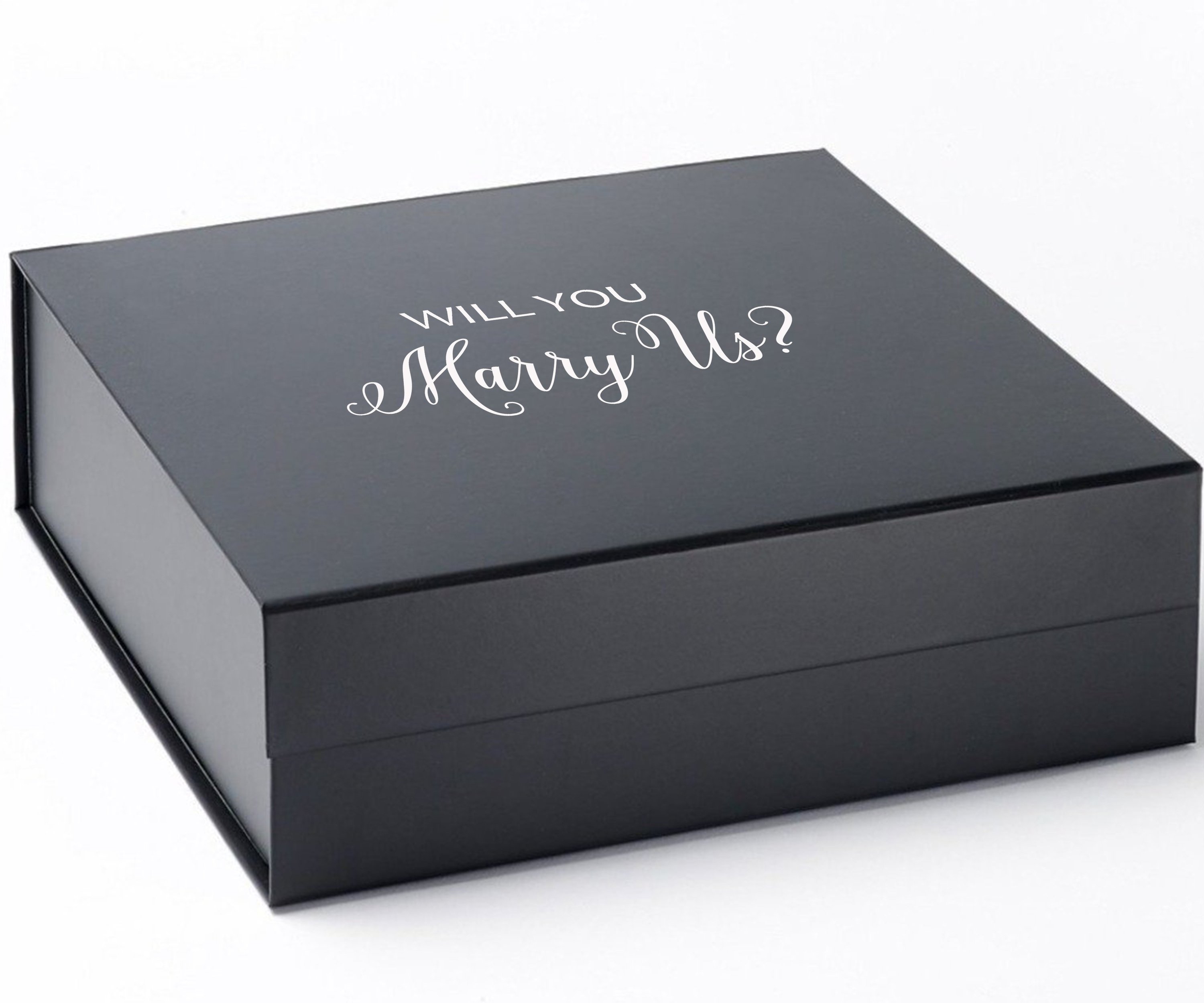 Elegant black proposal box with metallic writing, showcasing a sleek design without ribbon or border.