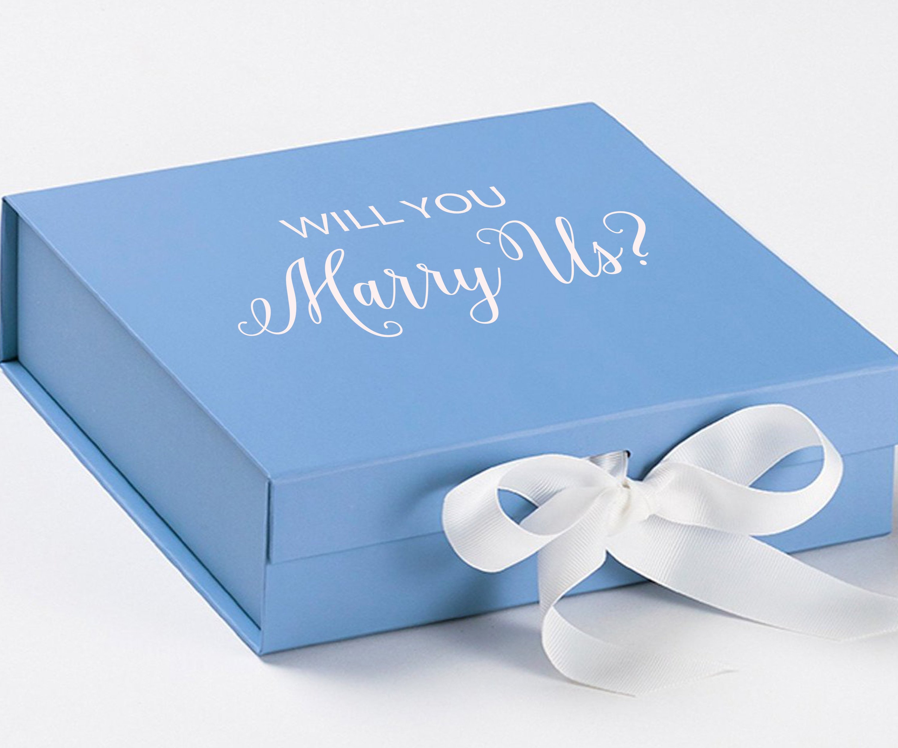 Light blue proposal box with white bow and metallic writing, perfect for engagement gifts.