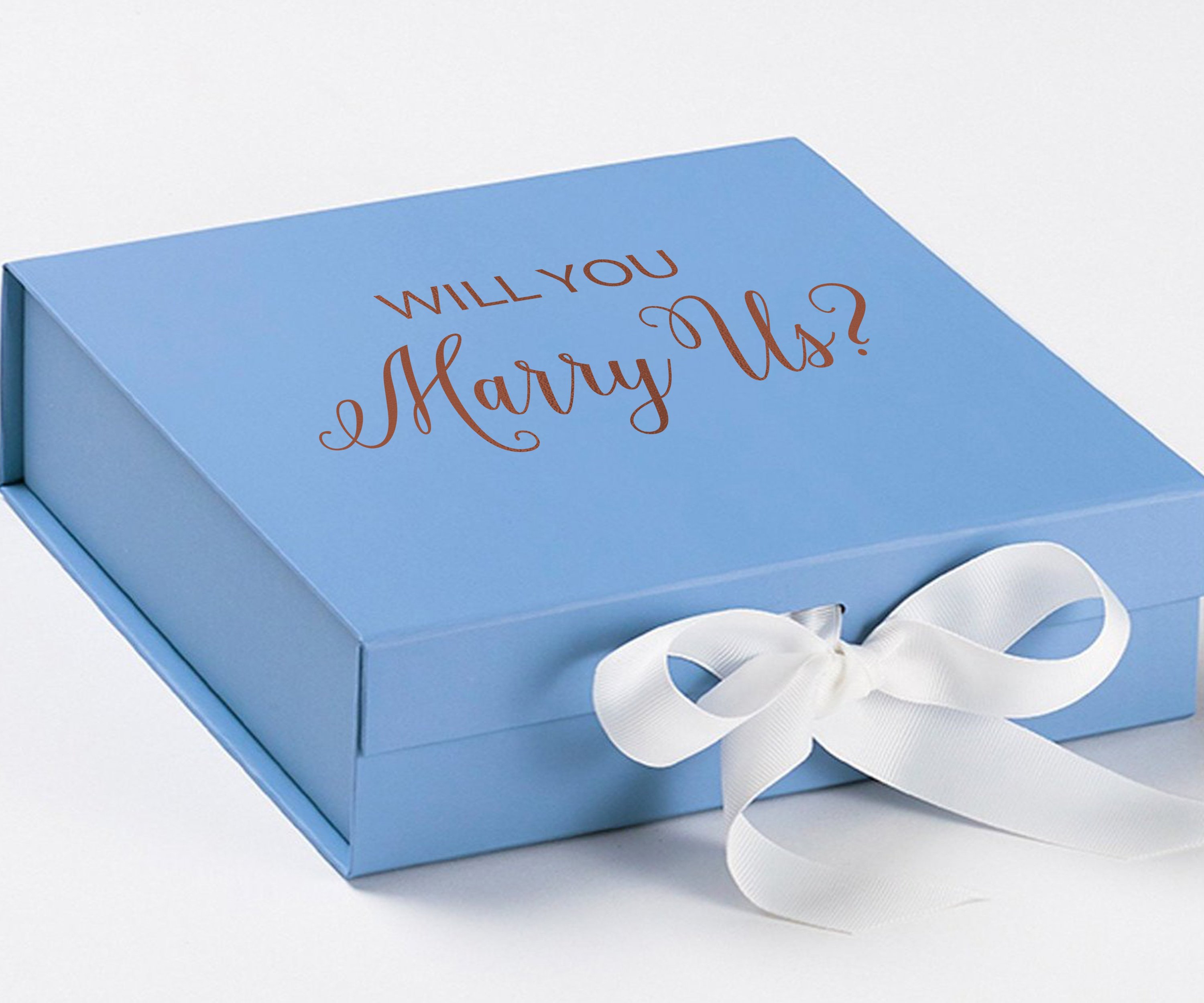 Light blue proposal box with white bow and metallic writing, perfect for engagement gifts.