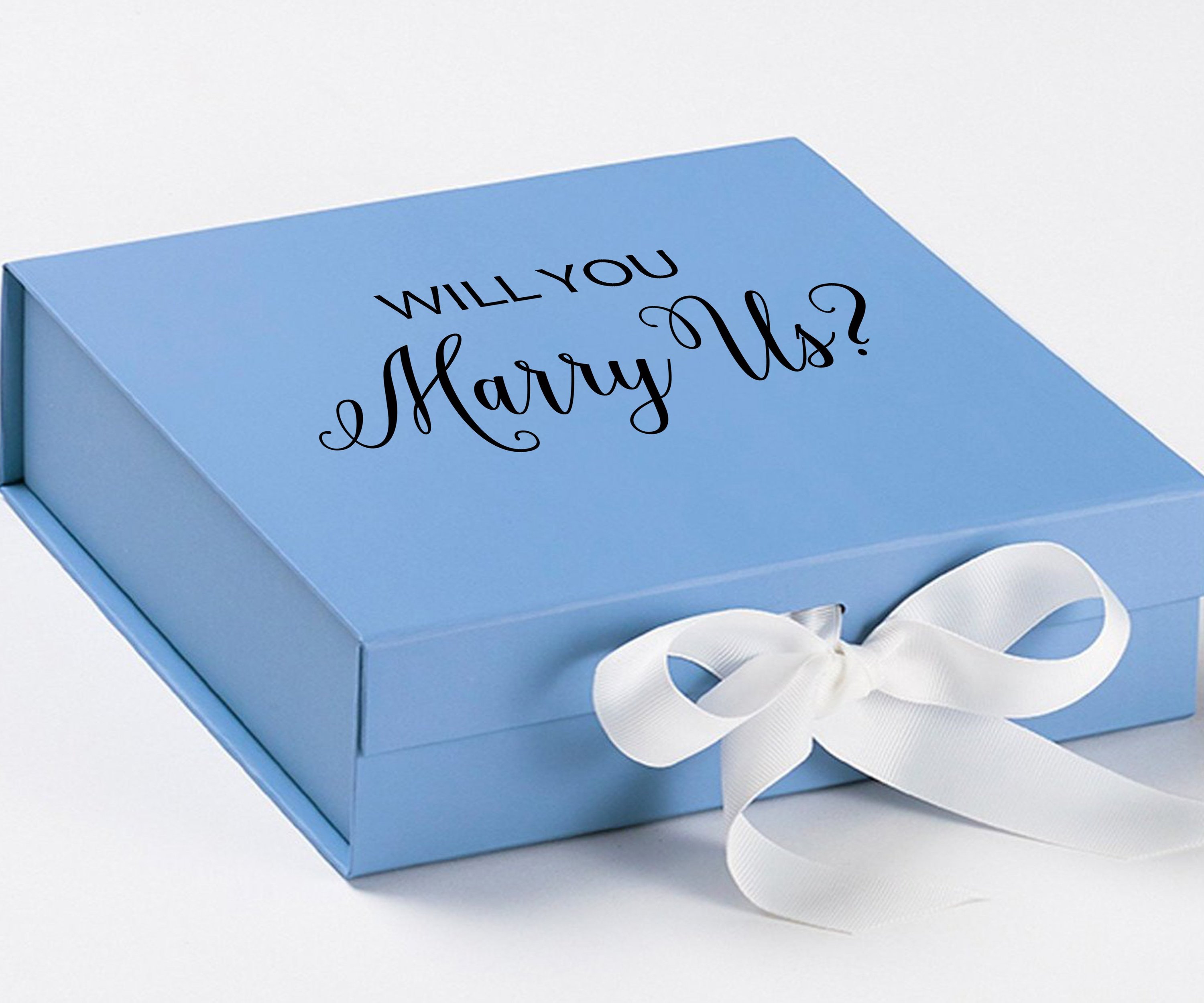 Light blue proposal box with white bow and metallic writing, perfect for engagement gifts.