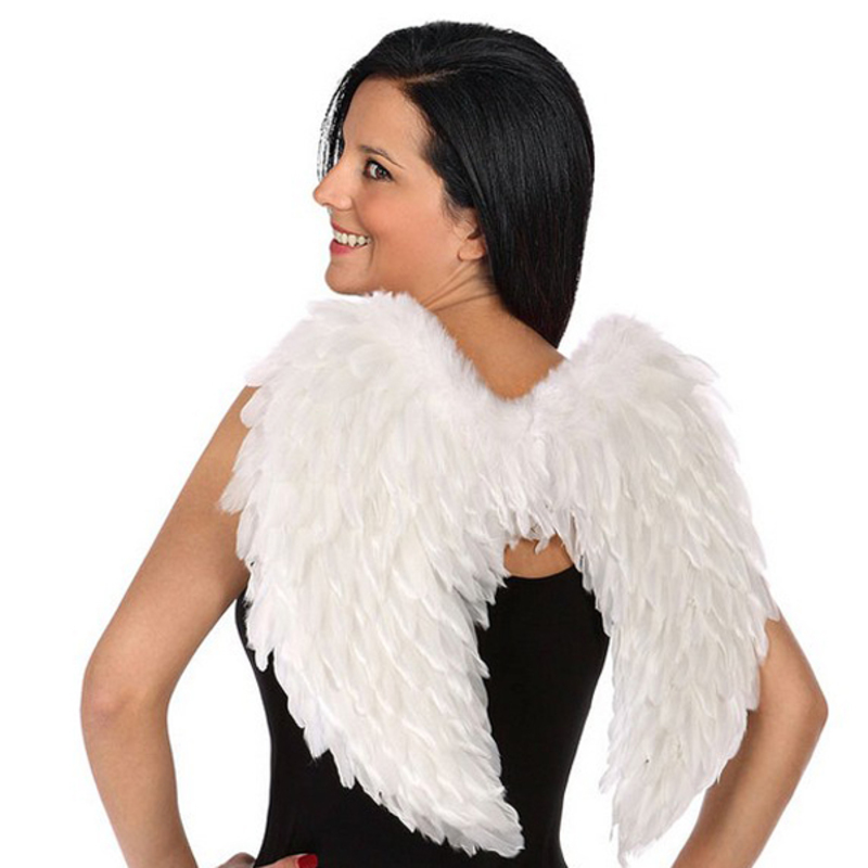 Person wearing white angel wings.