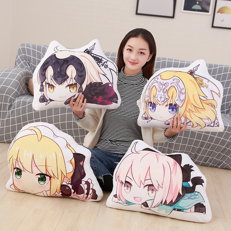 Person holding anime character pillows.