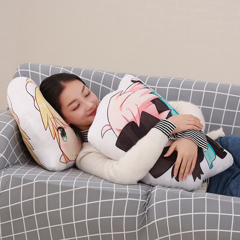 Woman cuddling anime character pillows.