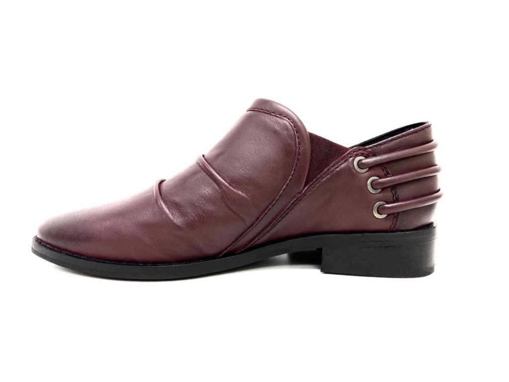 Annie Burgundy Dress Loafer showcasing elegant leather design, slouchy upper, decorative back cords, and low block heel.