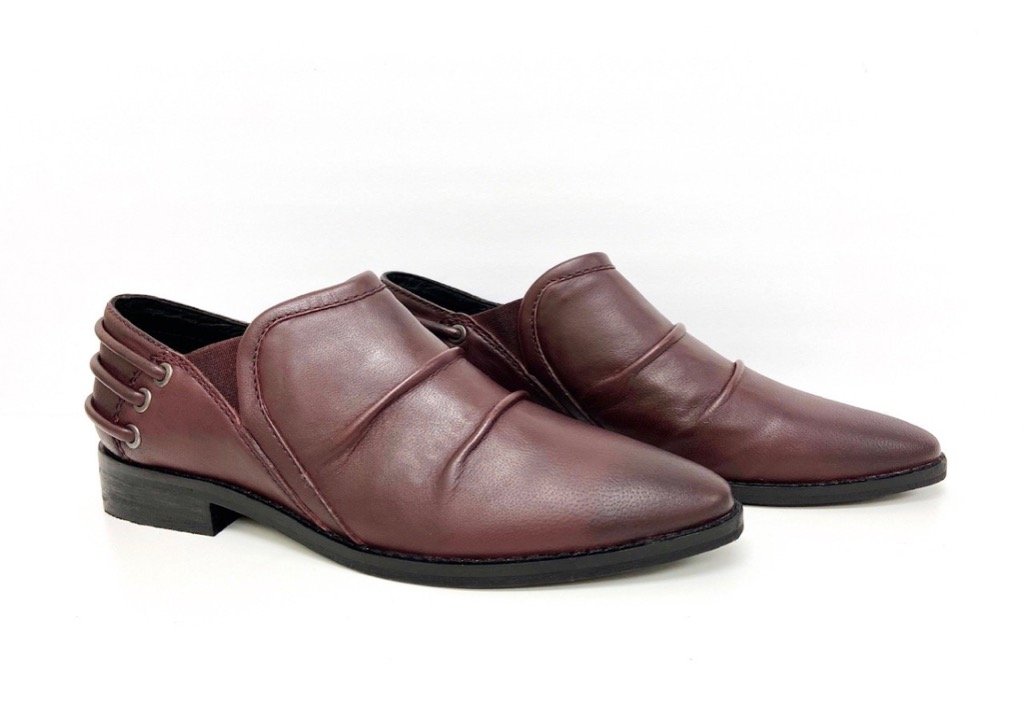 Annie Burgundy Dress Loafer showcasing elegant leather design, slouchy upper, decorative back cords, and low block heel.