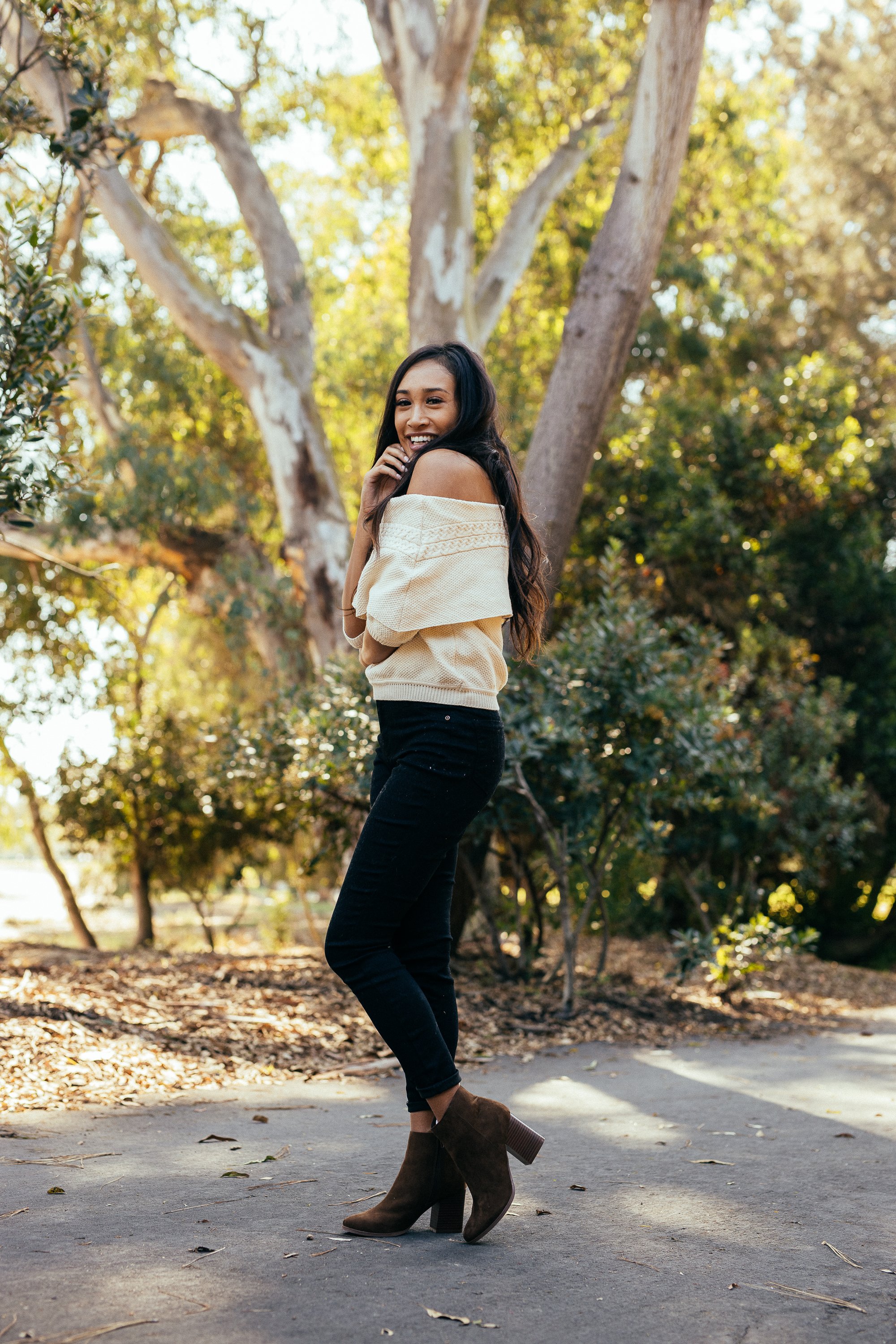 A pair of Women's Malibu Boots in brown featuring a stacked heel, almond toe, and side zip closure, perfect for stylish outings.