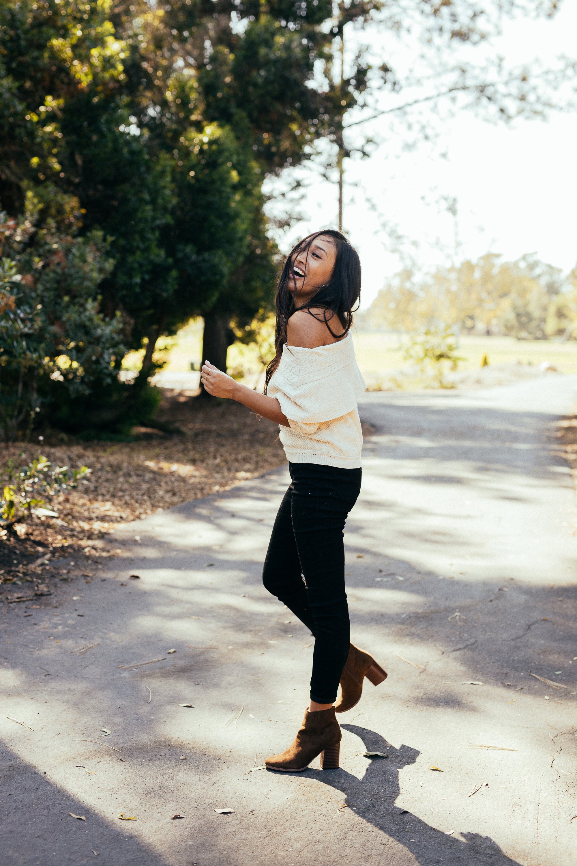 A pair of Women's Malibu Boots in brown featuring a stacked heel, almond toe, and side zip closure, perfect for stylish outings.