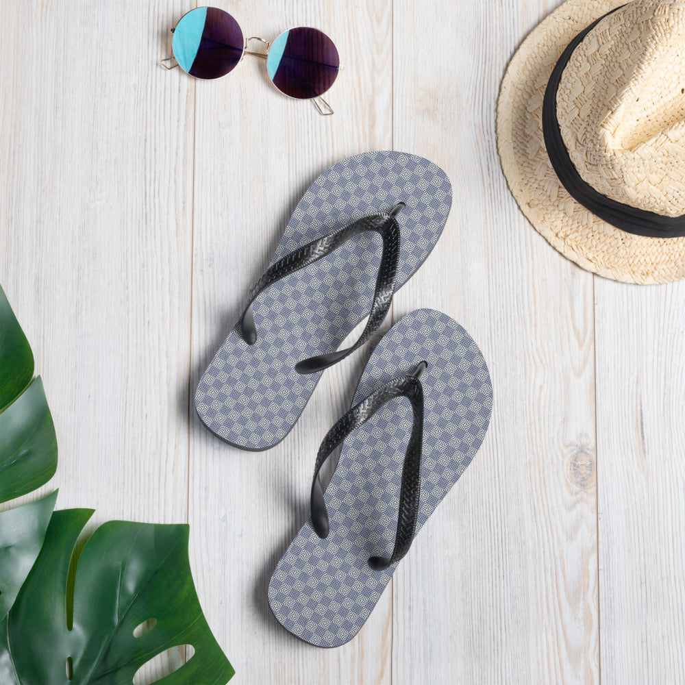 A pair of Grey Blue Mens Womans Flip-Flops featuring a soft fabric lining, durable rubber sole, and black Y-shaped straps, perfect for summer wear.