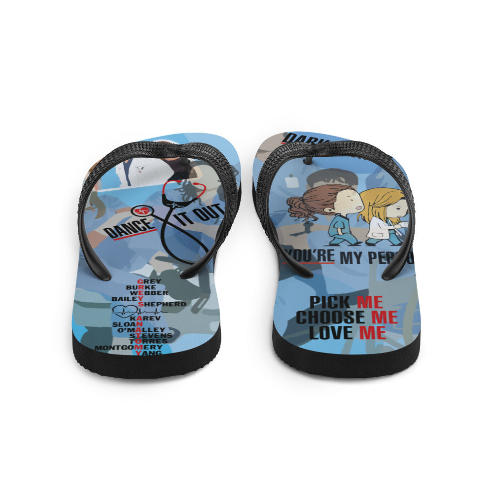 A pair of colorful Greys Flip-Flops with black Y-shaped rubber straps and soft fabric lining, perfect for summer adventures.