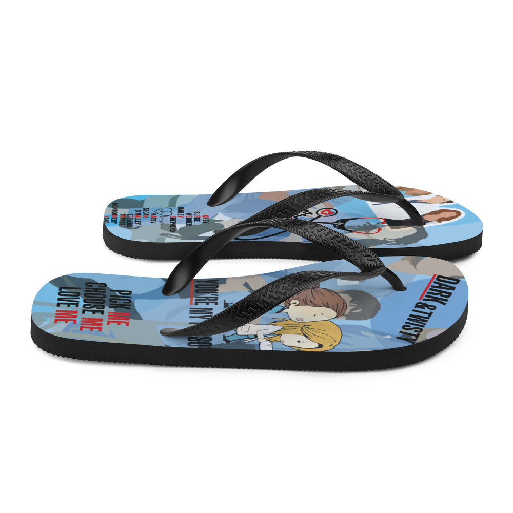 A pair of colorful Greys Flip-Flops with black Y-shaped rubber straps and soft fabric lining, perfect for summer adventures.