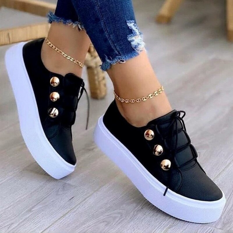 A pair of light breathable casual female flat shoes in black, white, gold, and rose gold, showcasing their stylish design and comfortable fit.