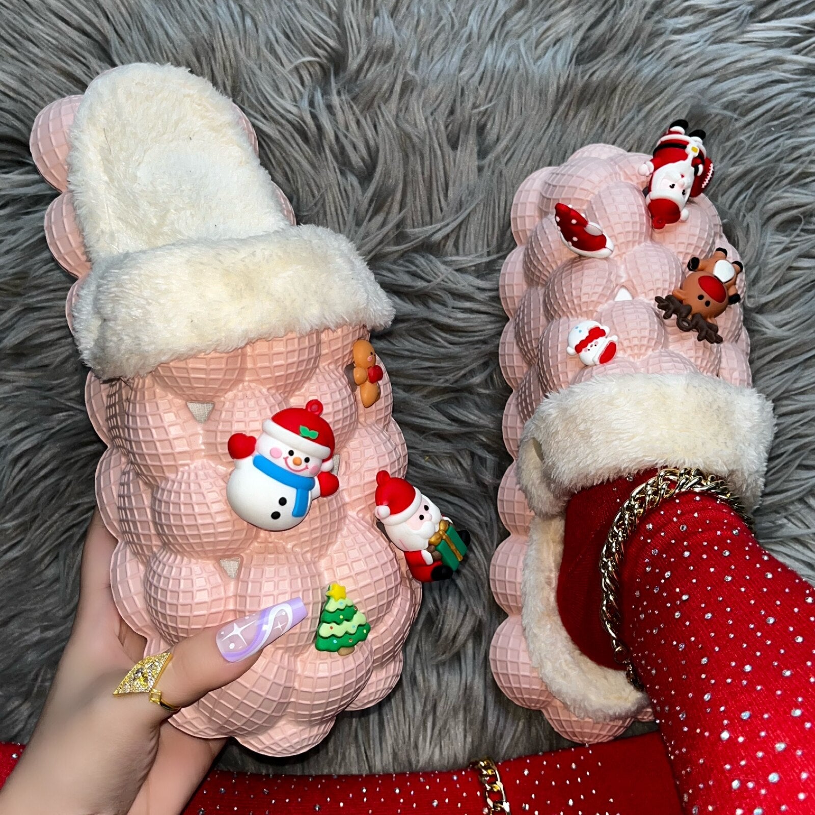 A pair of pink furry house slides with a fluffy texture, designed for indoor comfort and fun, featuring a bubble slipper style perfect for Christmas.