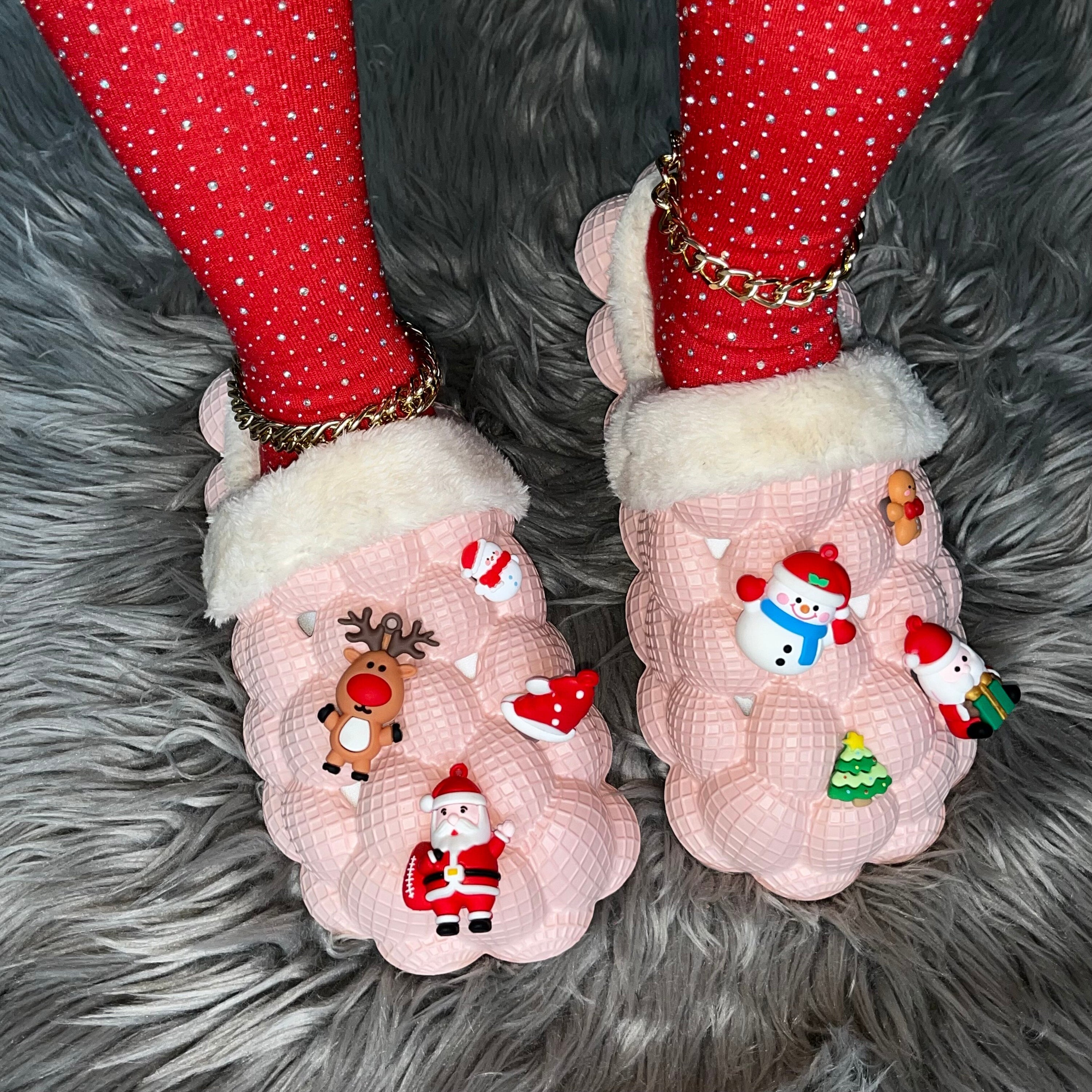 A pair of pink furry house slides with a fluffy texture, designed for indoor comfort and fun, featuring a bubble slipper style perfect for Christmas.