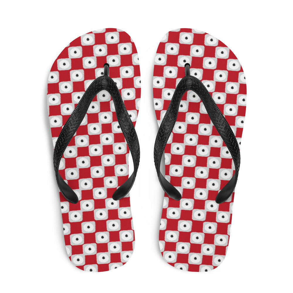 A pair of red chequered pattern flip-flops with black Y-shaped rubber straps and a soft fabric lining, perfect for summer wear.