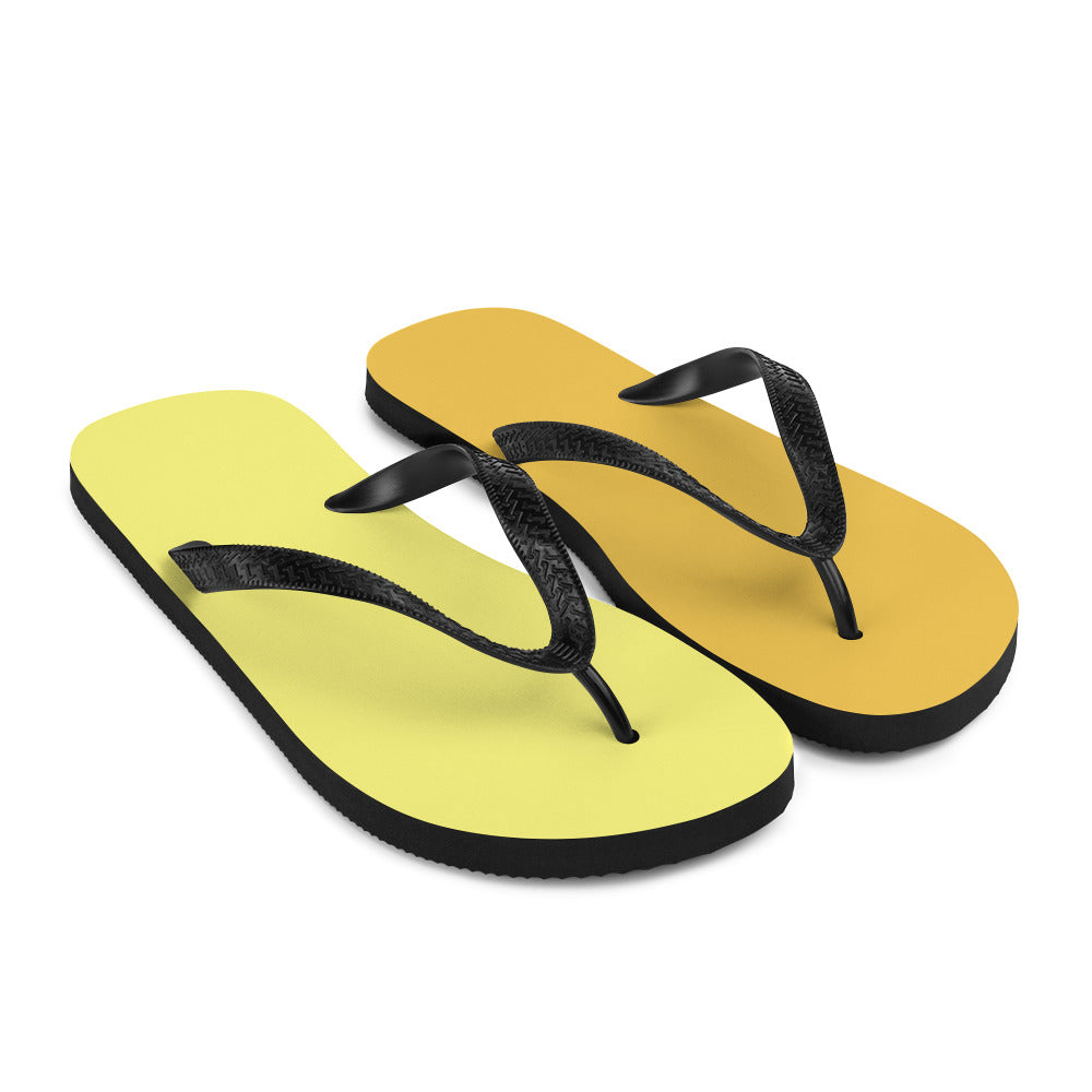 A pair of vibrant yellow and orange flip-flops with black rubber straps, featuring a comfortable rubber sole and soft fabric lining, perfect for summer wear.