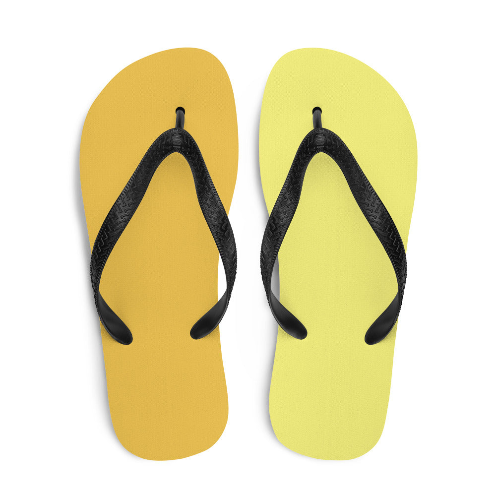 A pair of vibrant yellow and orange flip-flops with black rubber straps, featuring a comfortable rubber sole and soft fabric lining, perfect for summer wear.