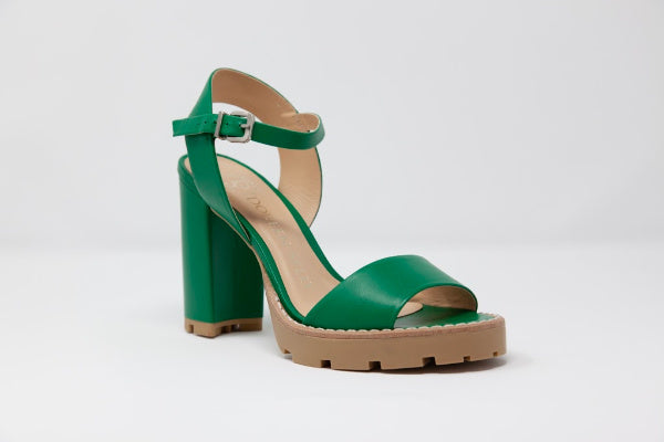 A pair of Anna Tony Leather Sandals featuring a 4-inch block heel, open toe design, and adjustable quarter strap, set against a neutral background.