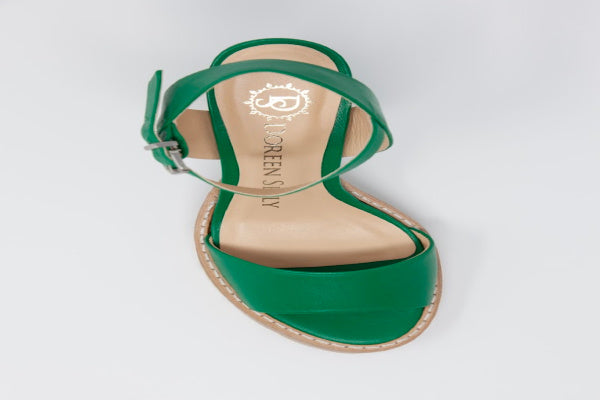 A pair of Anna Tony Leather Sandals featuring a 4-inch block heel, open toe design, and adjustable quarter strap, set against a neutral background.