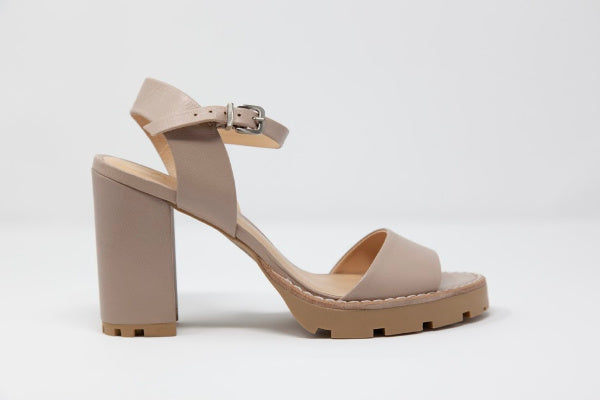 A pair of Anna Tony Leather Sandals featuring a 4-inch block heel, open toe design, and adjustable quarter strap, set against a neutral background.