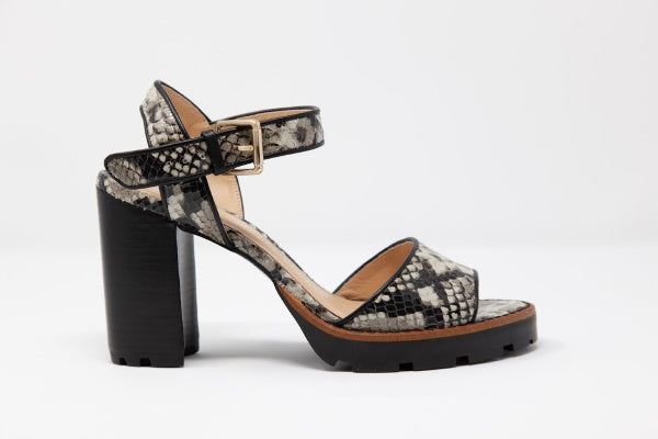 A pair of Anna Tony Leather Sandals featuring a 4-inch block heel, open toe design, and adjustable quarter strap, set against a neutral background.