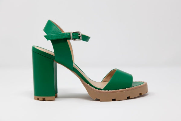 A pair of Anna Tony Leather Sandals featuring a 4-inch block heel, open toe design, and adjustable quarter strap, set against a neutral background.