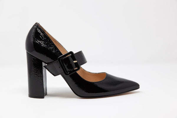 A pair of elegant Free 'Mary Jane' Leather Pumps featuring a baroque buckle and a comfortable block heel, crafted from genuine patent leather.