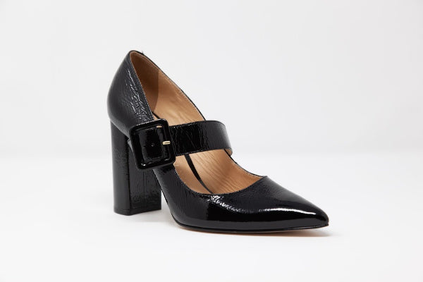 A pair of elegant Free 'Mary Jane' Leather Pumps featuring a baroque buckle and a comfortable block heel, crafted from genuine patent leather.